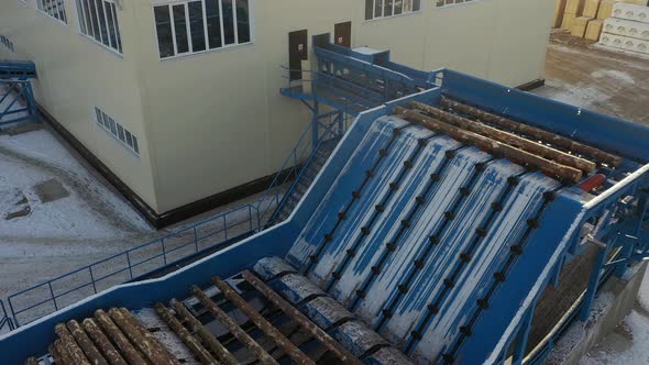 Aerial View of Lumber Factory. Wooden Beam on Conveyor, Wood Processing at a Woodworking Factory.