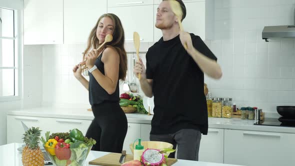 Man and woman dancing in kitchen