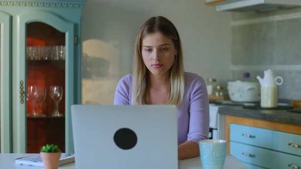 Young Woman is Working with Laptop Then Resting at Table in Apartment Room Rbbro