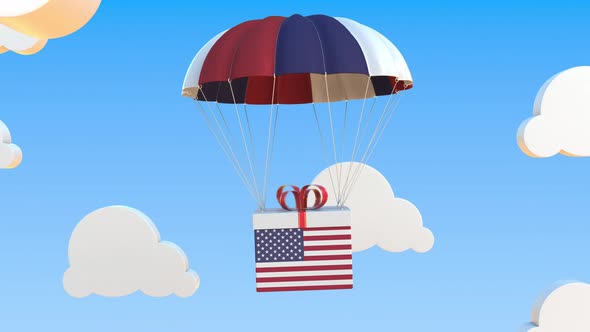 Box with Flag of the USA Falls with a Parachute