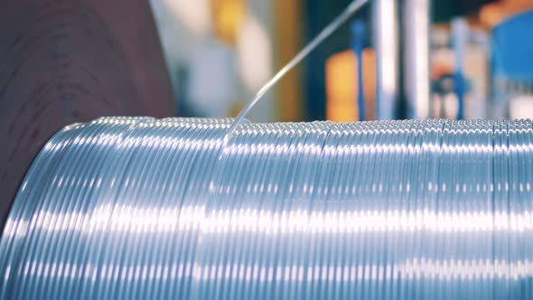 Silver Wire Unwinding From a Spool