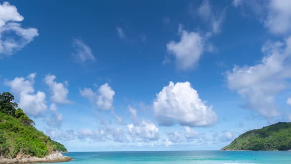 Time Lapse movement of summer white clouds flowing over the sea