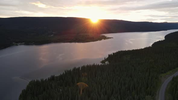 Last light over the picturesque and serene Dease Lake in British Columbia, Canada. Wide angle aerial