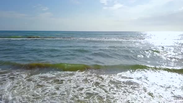 Wind Beats the Waves To the Sandy Beach