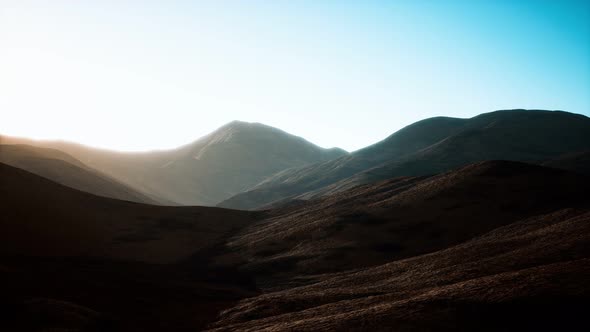 Hills with Rocks at Sunset