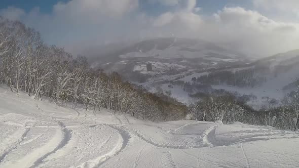 POV of a young man skier skiing on a snow covered mountain.