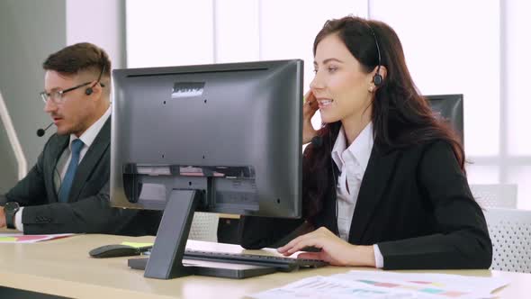 Business People Wearing Headset Working in Office