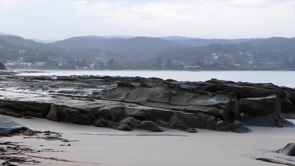 Lorne foreshore during sunset. Smoke from a fire haze fills the air along the costal town. SLOW MOTI