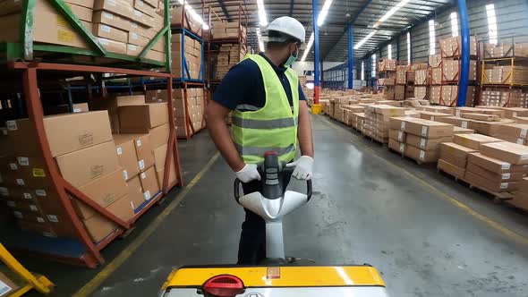 Pallet Truck Operator In A Warehouse