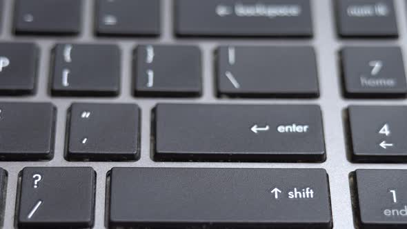 Enter Button Pressing a Lot of Times on Keyboard Laptop Keyboard Close Up