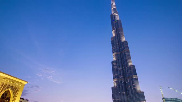 Bridge and Fountains with Burj Khalifa Day To Night Transition Dubai Emirates Timelapse