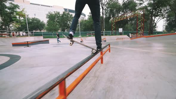 Skateboarder in Skate Park Doing Tricks Slow Motion