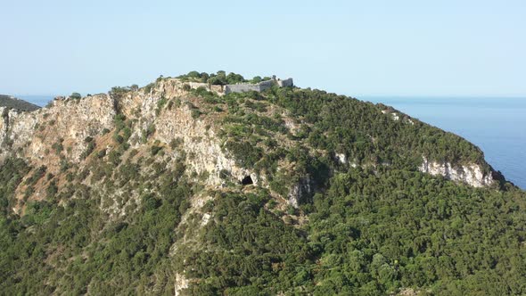Aerial view of Palaiokastro (Old Navarino) castle with solitary visitor, near Pylos, Greece, Europe