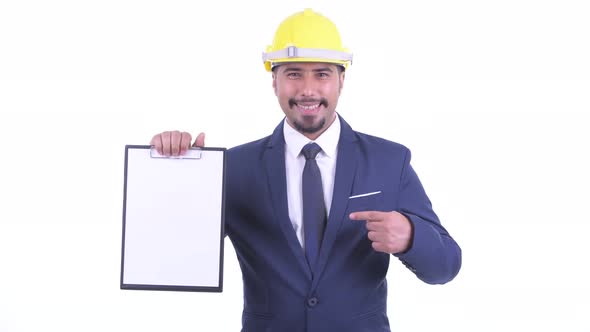Happy Bearded Persian Businessman As Engineer Showing Clipboard and Giving Thumbs Up