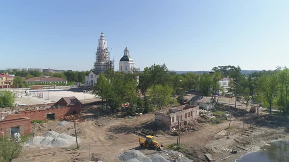 Aerial view of Construction of a embankment and pier with a gazebo on the city pond. 02