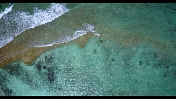 Aerial drone panorama of tranquil lagoon beach time by shallow ocean with white sand background of j