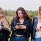 Portrait of three young women with smart phones outdoors, Italy - VideoHive Item for Sale