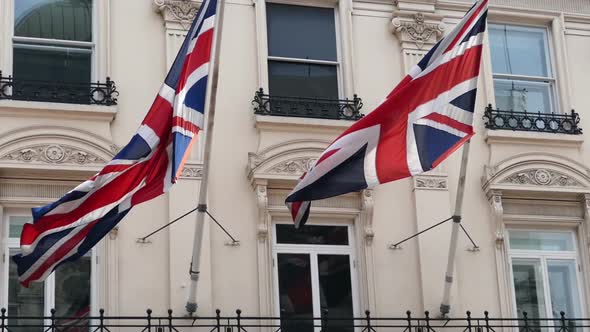 Two UK Flags On A Building