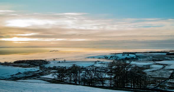 Cloud inversion covering the Eden Valley in Cumbria with the Lakeland mountains in the background, a