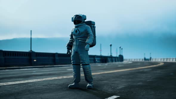Astronaut in Space Suit on the Road Bridge alt