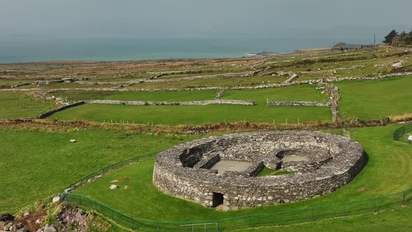 Loher Ringfort, Kerry, Ireland, March 2022. Drone orbits the ancient monument from the southeast and