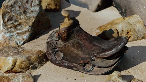 Very Old Horse Saddle on Sand Beach