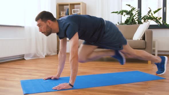 Man Doing Running Plank Exercise at Home 