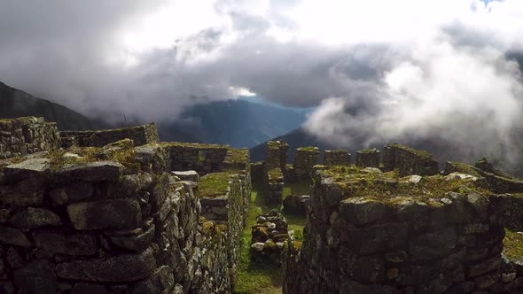 Time Lapse of ancient Inca Ruins in mountains with clouds swirling past.