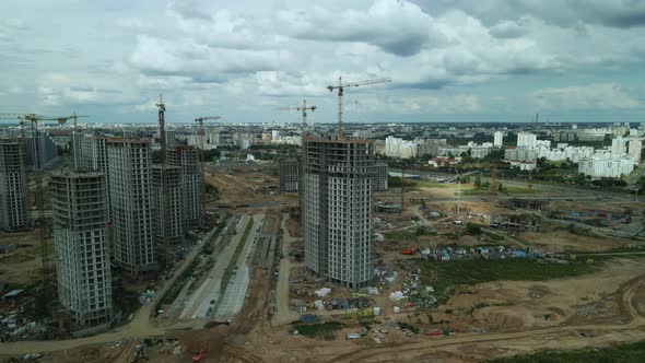 Construction site. Construction of multi-storey buildings. Construction of a city block. Aerial phot