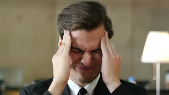 Headache at Work, Businessman Portrait in Office