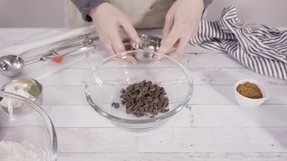 Mixing ingredients to bake chocolate raspberry cupcakes.