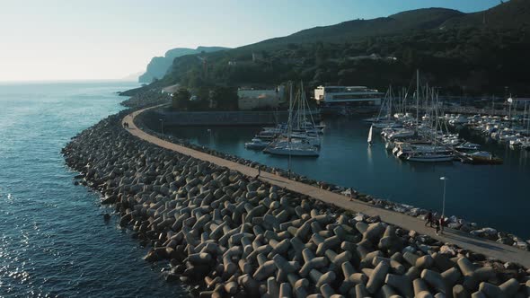 Sesimbra resort city at winter evening, beautiful sunset over the town with the port