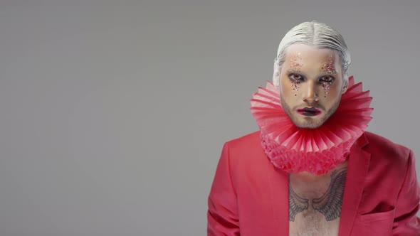 Portrait of Man with Theatrical Make-Up Miming Smile