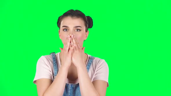 Girl Is Very Surprised and Upset on Green Screen at Studio, Slow Motion