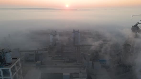 Aerial View of Cement Factory with High Concrete Plant Structure and Tower Crane at Industrial