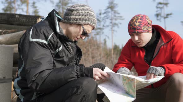 Two Tourists in the Forest Make a Route on the Map