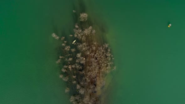 Aerial view of a person kayaking on Plastiras lake in Greece.