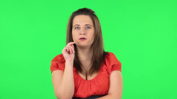Portrait of Cute Girl Focused Thinking About Something, No Idea. Green Screen