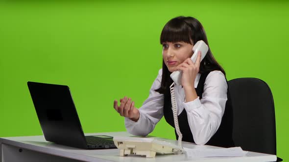 Woman Boss Scolds the Subordinates By Telephone. Studio