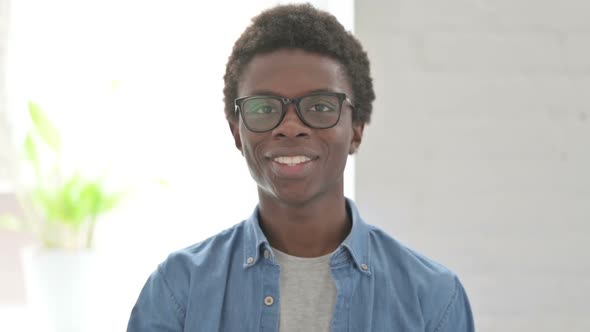 Portrait of Young African Man Showing Thumbs Up