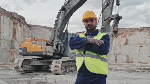 Male Worker in Granite Quarry Posing