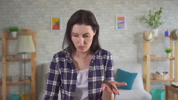 Young Upset Woman Has a Lot of Hair Falls Out After Chemotherapy