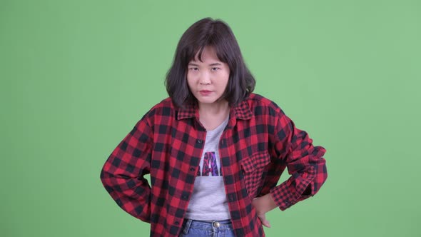 Angry Asian Hipster Woman Giving Thumbs Down