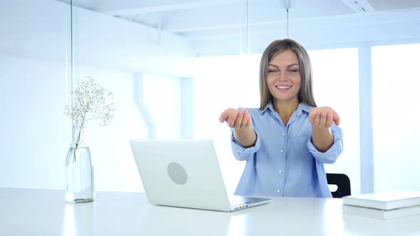 Woman in Office Inviting Customers with Both Hands