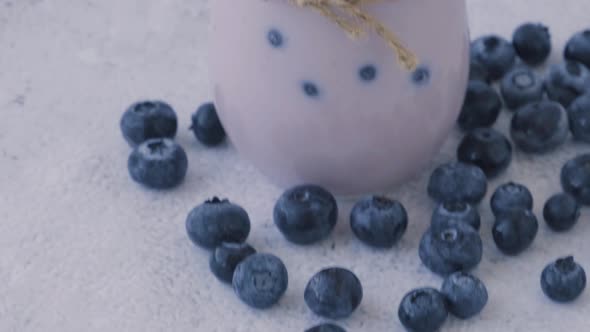 Bowl with Yogurt and Blueberries on Table
