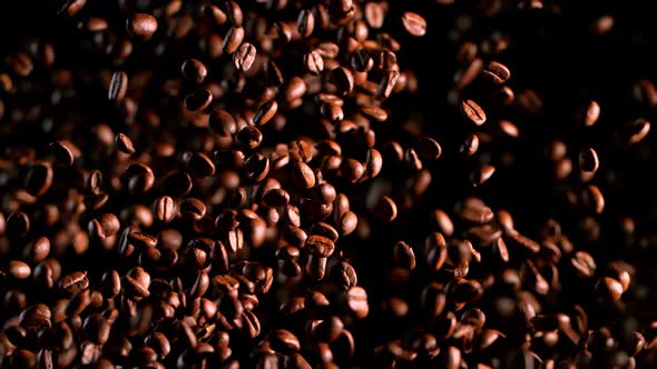 Super Slow Motion Shot of Exploding Premium Coffee Beans Isolated on Black at 1000Fps