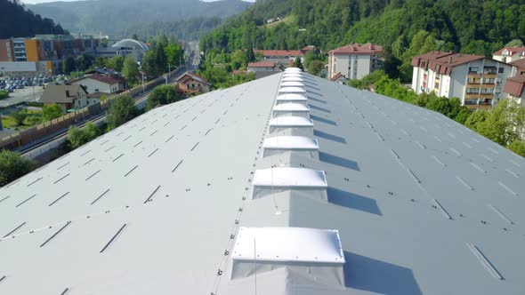 Big sports hall rooftop insulated with temperature isolation panels with roof lightning plastic dome