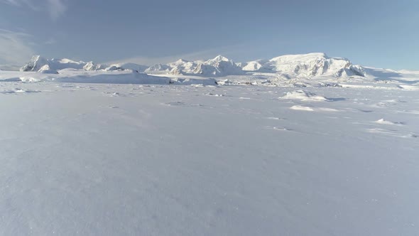 Snow Covered Arctic Surface Aerial Flight View