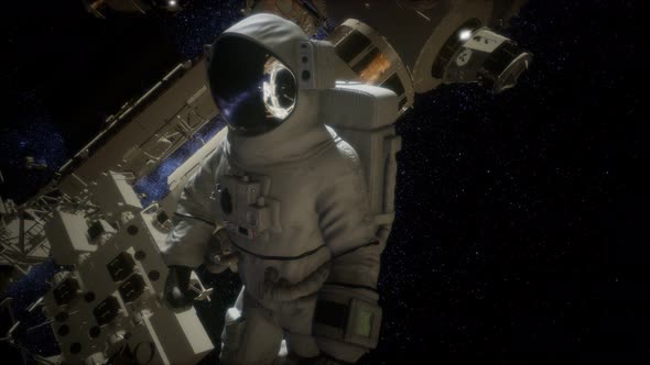 Astronaut Outside the International Space Station on a Spacewalk alt