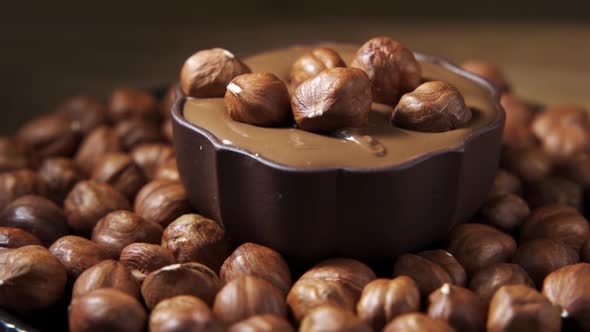 Hazelnuts Covering with Melted Chocolate